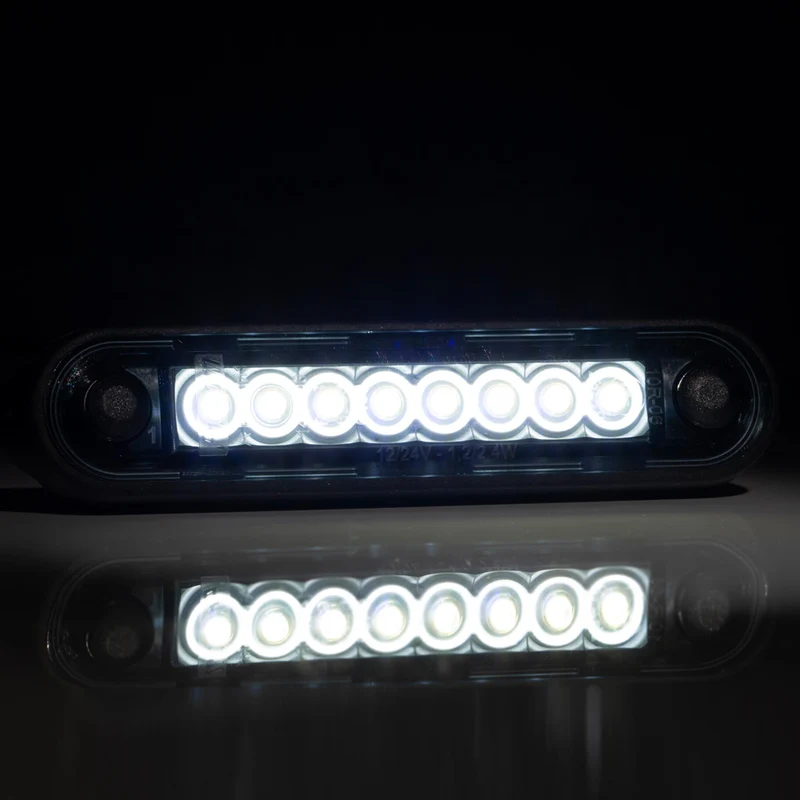 Luces LED marcadoras largas Fristom con lente ahumada